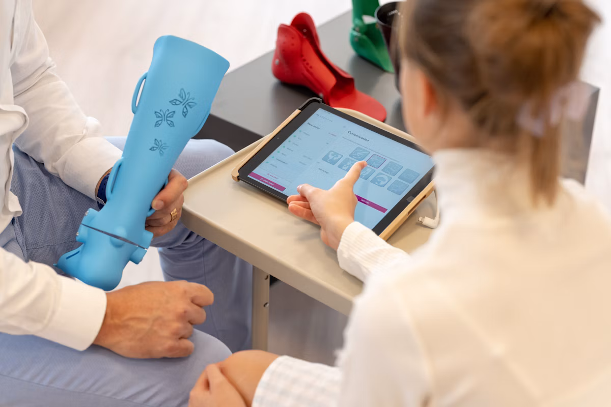 Healthcare professional reviewing notification settings on a tablet